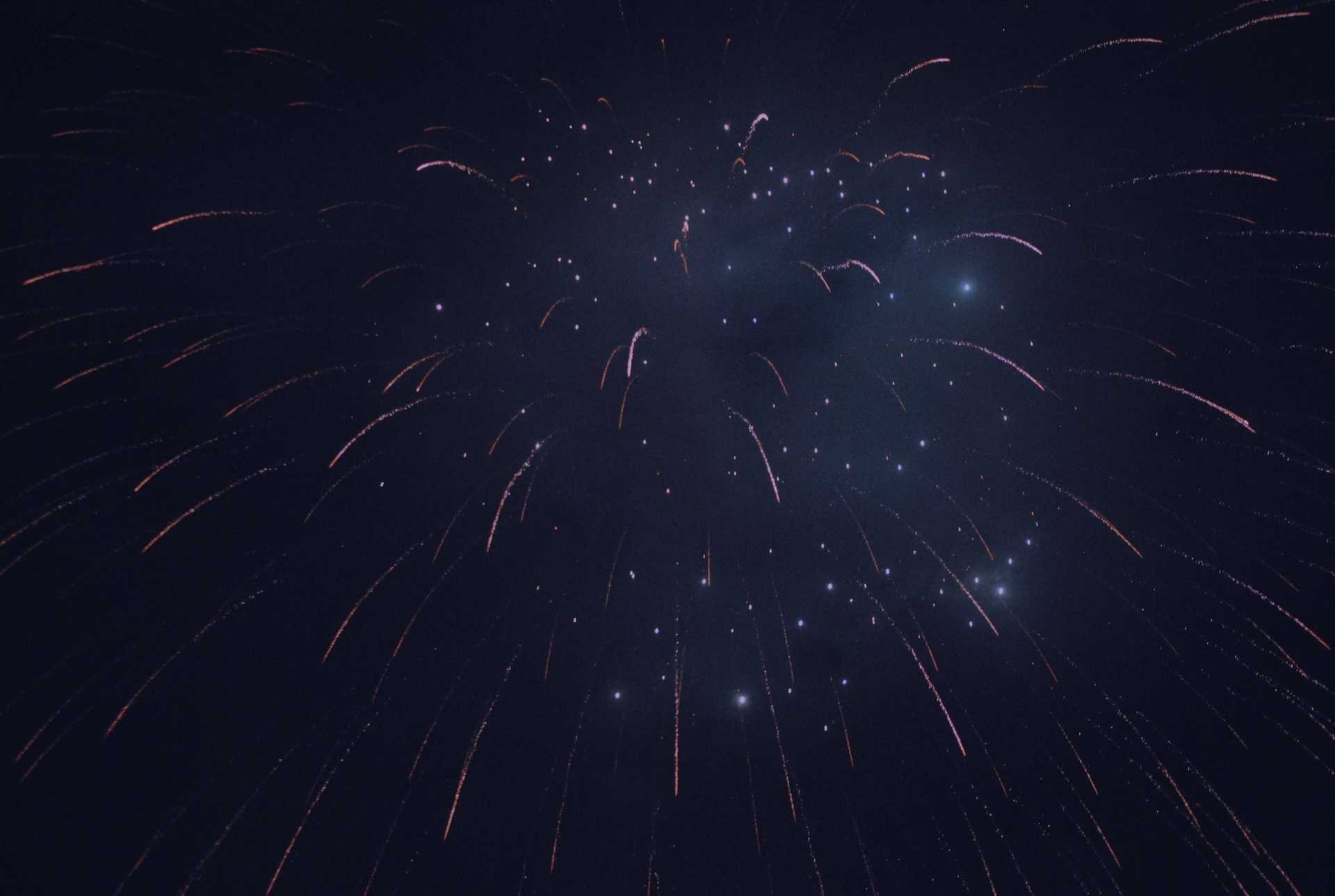 A firework explosion in the night sky